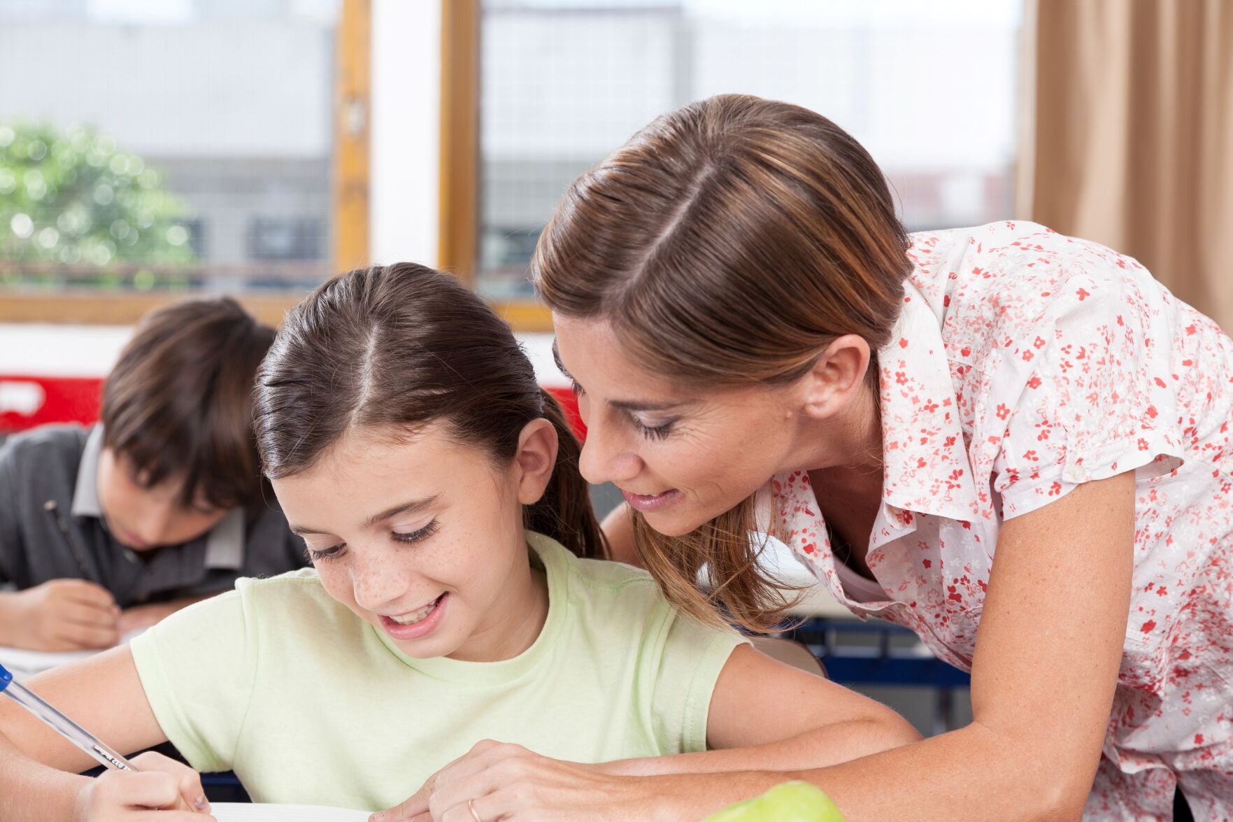 Teacher Helping Student